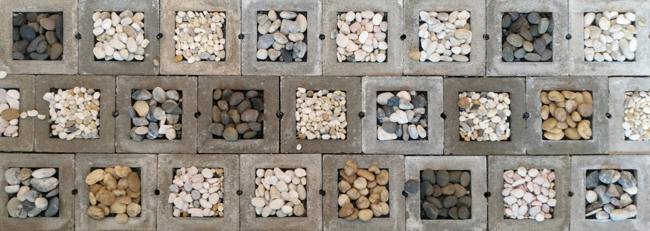 Stone in concrete block pattern background.